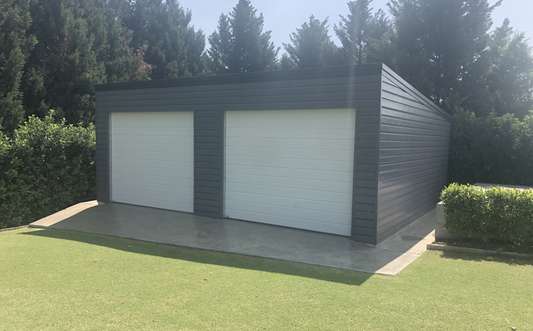 black garage shed with white doors